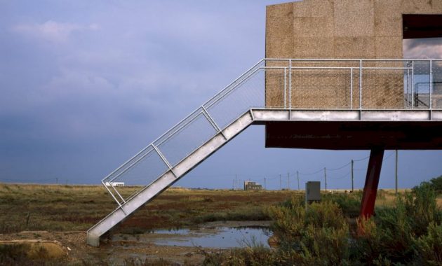 A Cork-Clad Cabin Above A Tidal Salt Marsh