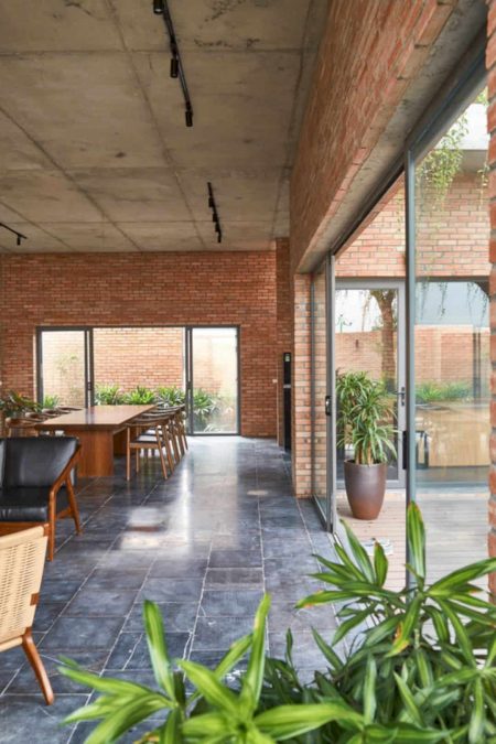 Mao Khe House: Red Brick Walls of House with Layers of Green Trees and ...