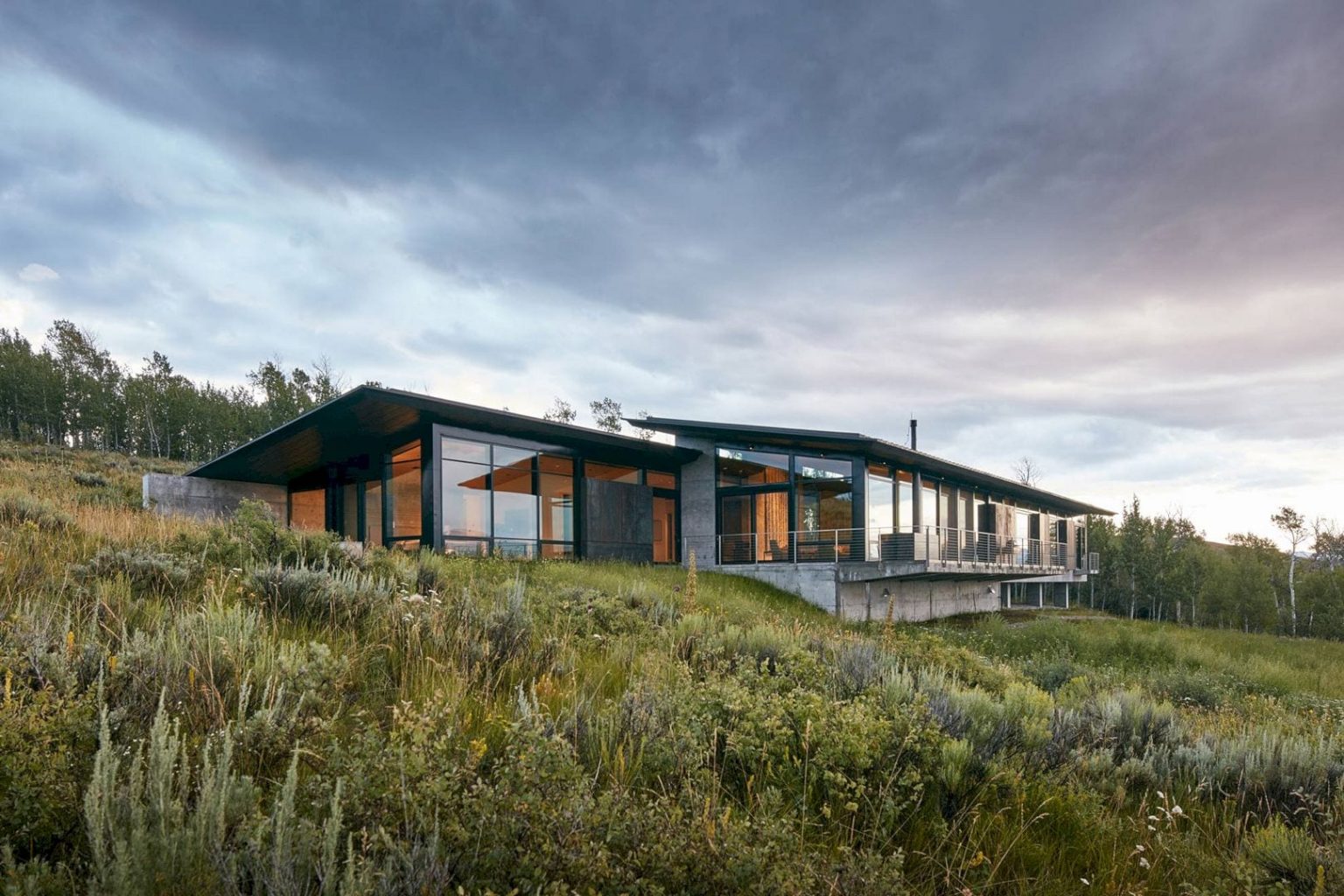 10 Sleek And Timeless Home Exteriors Feature Nature-Inspired Materials