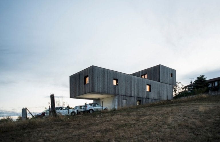 Passive House: A Two-Storey House with A Wood Frame and Concrete Base