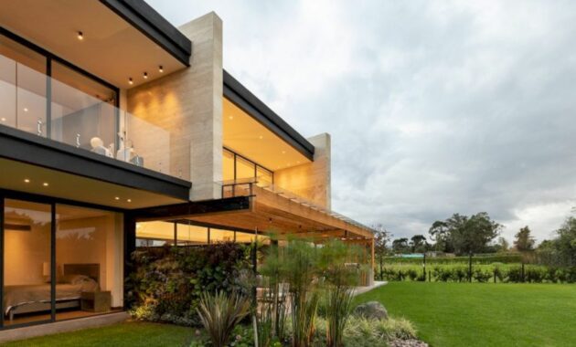MR House: A Big House with Two Main Walls and Spacious Spaces