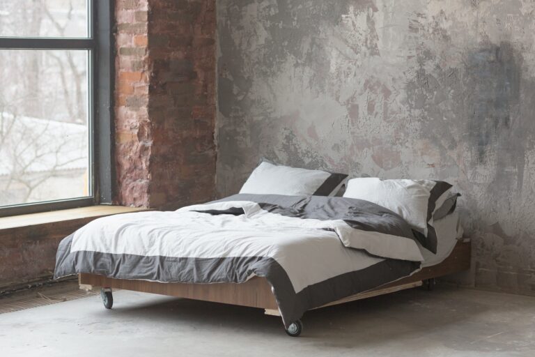 7 Trendy Bachelor Bedroom Ideas In Industrial Style   Loft Style Bedroom Interior With Bed Gray Design Brick Texture And Concrete Wall 768x512 