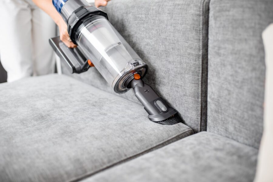 Cleaning Sofa With A Modern Cordless Vacuum Cleane 2023 11 27 05 25 47 Utc