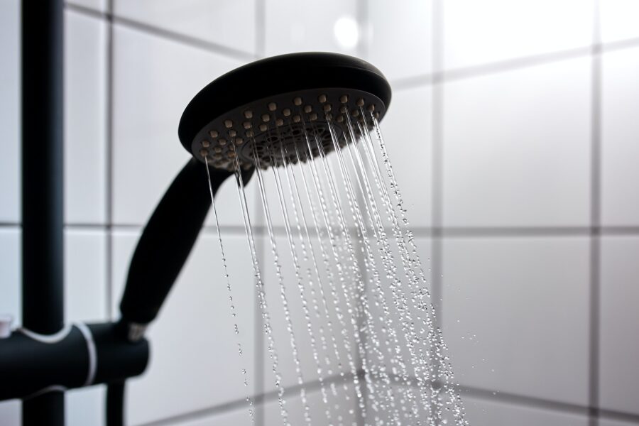 Water from the shower in the modern bathroom