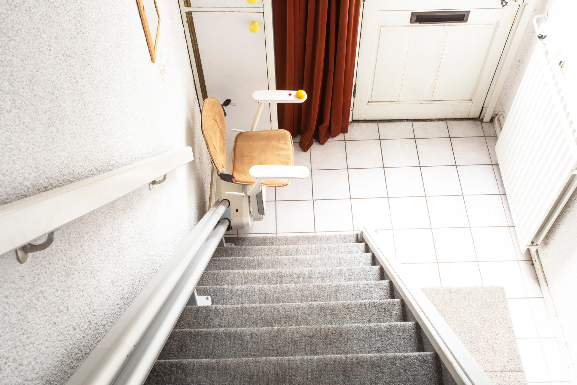 Automatic Stair Lift On Staircase Taking Elderly People And Disabled Persons Up And Down In A House