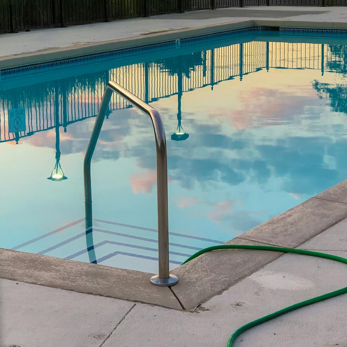 A tranquil pool reflecting the evening sky, showcasing peace and relaxation.