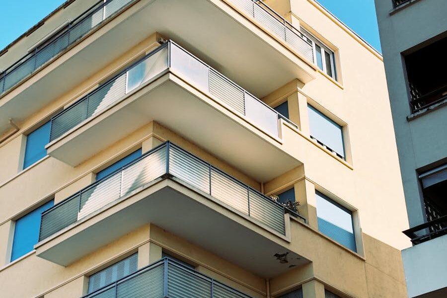 Explore the contemporary architecture of a Villefranche-sur-Saône apartment building with sleek balconies.